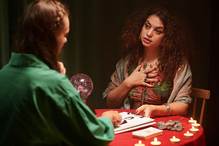 A psychic giving psychic readings to help a client explore their energy and gain self-awareness.